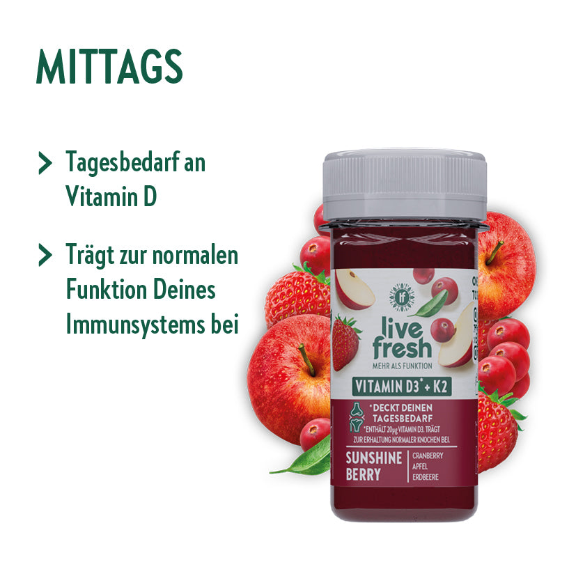 „Live Fresh Vitamin D Shot“ mit der Geschmacksrichtung „Sunshine Berry“, der mittags eingenommen werden soll. Der Shot deckt den Tagesbedarf an Vitamin D und trägt zur normalen Funktion des Immunsystems bei. Die Flasche wird von Zutaten wie Himbeeren, Äpfeln und Cranberries umgeben, die die natürlichen Inhaltsstoffe des Shots hervorheben.